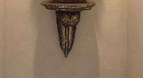 Ornate wall-mounted shelf/pedestal