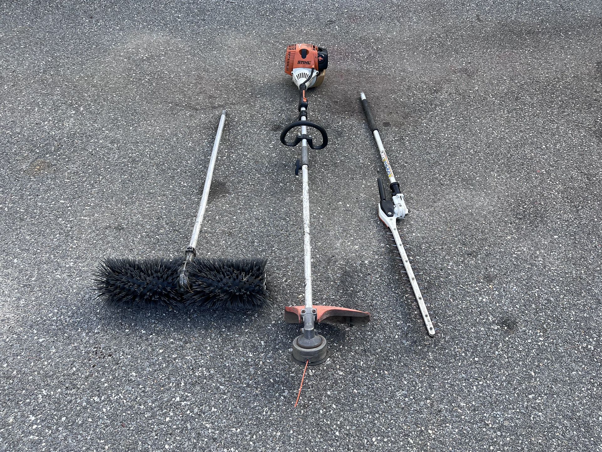 Stihl KM90R  Kumbi system with string, hedger and power broom attachments.