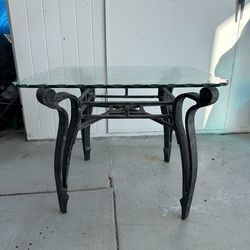 Glass wrought iron table.