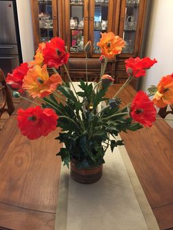 Silk flower arrangements of poppies