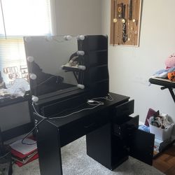 Vanity with lights and electrical outlets