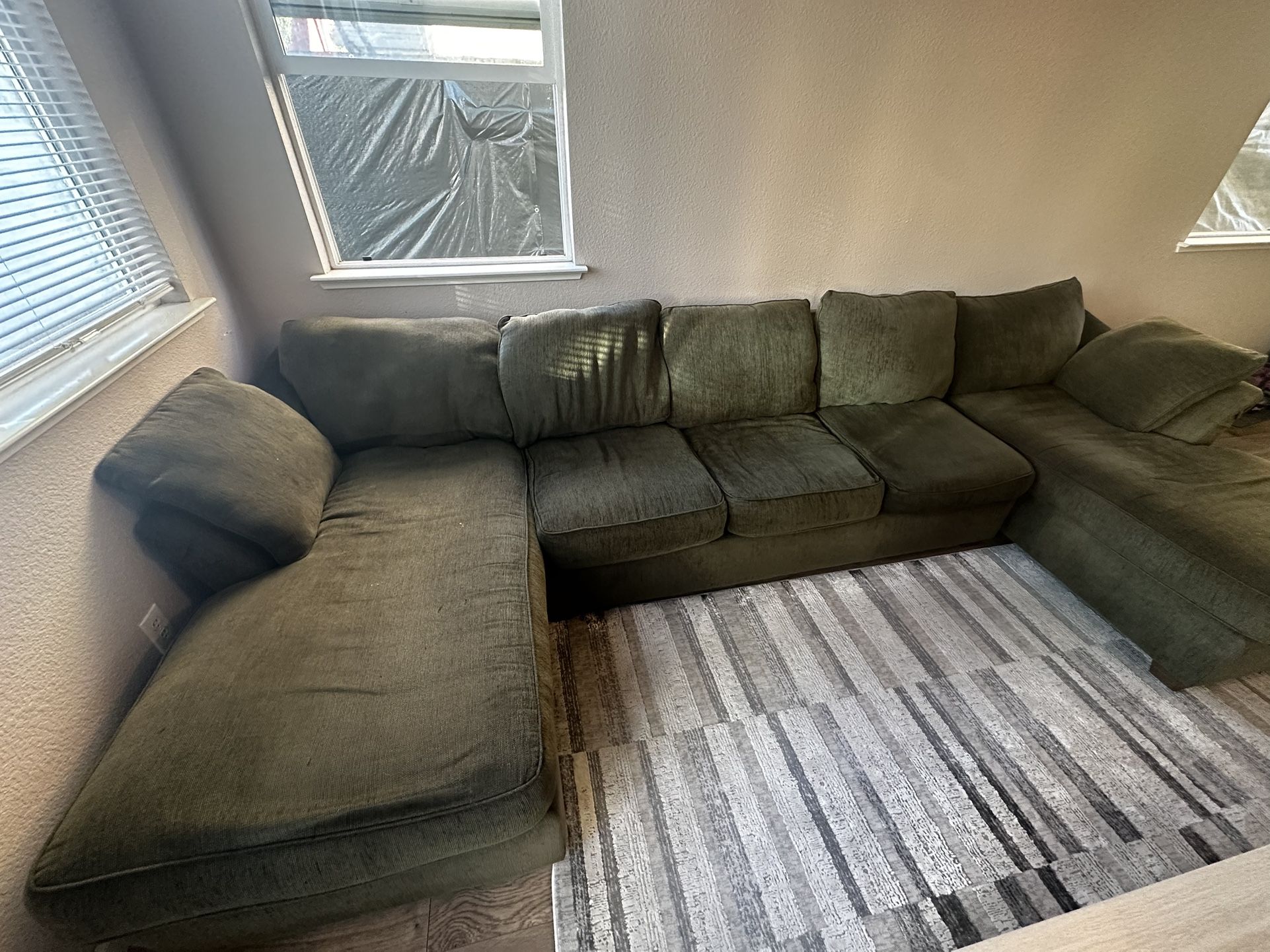 Green u shaped sectional with sleeper bed 