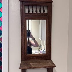 Mirror with towel rack