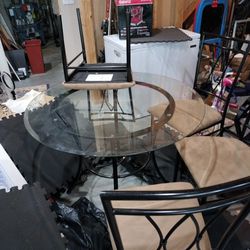 Slightly Used Glass Kitchen Table With Metal Frame Including Four Chairs