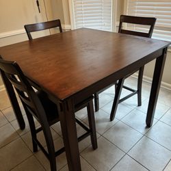 Moving Sale: Brown Wood Kitchen Table + 3 Chairs