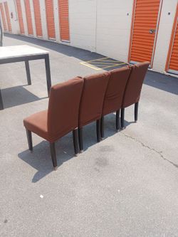 Set of 4 dining room or kitchen chairs with brown sleeve