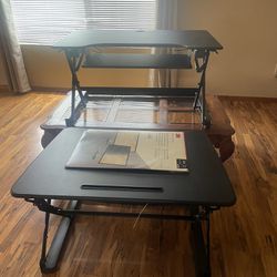 Adjustable desk stands
