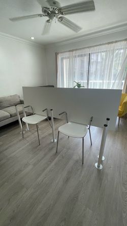 IKEA Two person desk with two chairs.