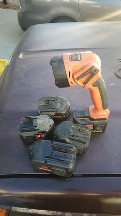 Milwaukee light and 4 batteries . No charger.