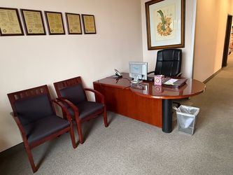 Reception desk, chairs and picture