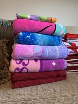 4 Disney Princess Blankets, 1 Red Blanket, and small H‑E‑B Buddy Baby Blanket