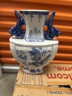 The selected item appears to be a vintage Chinese blue and white porcelain vase featuring hand-painted landscape or floral motifs and sculpted dragon