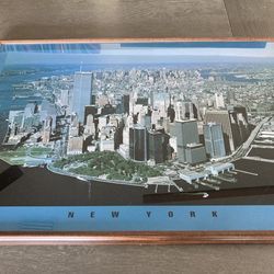 PICTURE OF NEW YORK SKYLINE WITH BROWN TTIM FRAME  -  26”  X.  38”