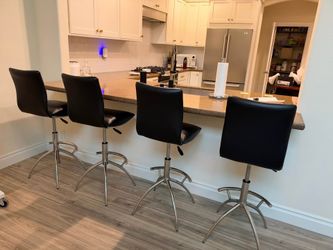 Set of 4 hydraulic barstools by New Spec - sells new for $800 on Sohomod