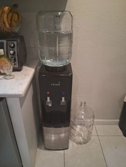 Primo water dispenser with 2 5gal glass jug