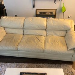 White leather couch, chair, and ottoman