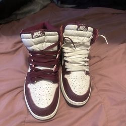 Burgundy and white Jordan 1s
