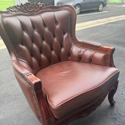 Vintage Rococo Design carved wood and leather armchair