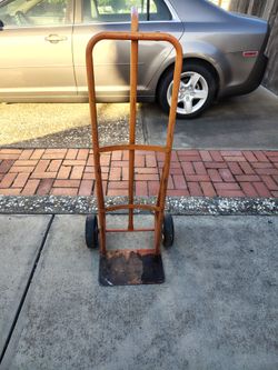 Heavy duty steel hand truck dolly Dolly has solid wheels so it never goes flat.