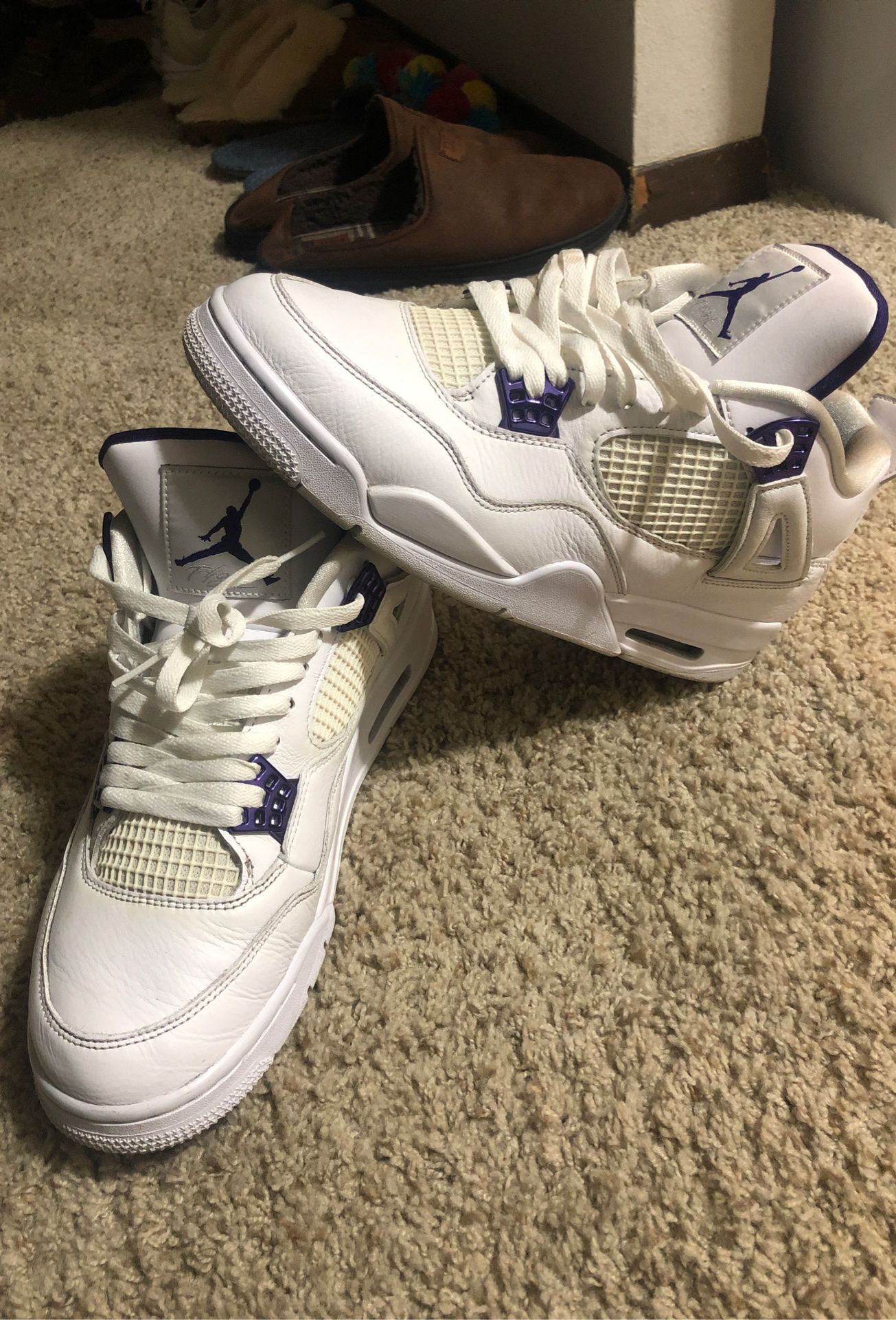 white and purple jordan 4's