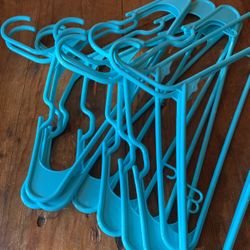 One Dozen Turquoise Plastic Hangers 