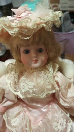 Beautiful porcelain doll with fur coat included