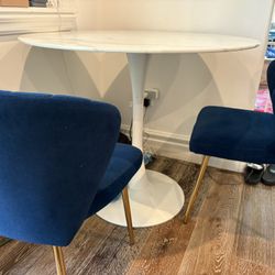 Marble Effect Round Dining Table With Blue Velvet Chairs