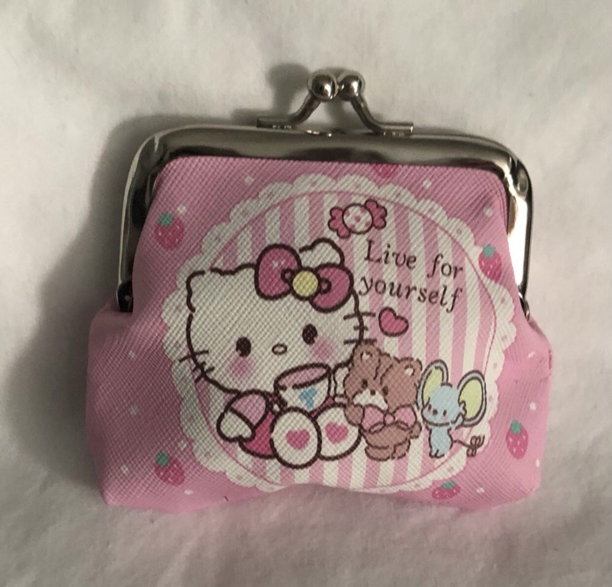 Hello Kitty coin purse live for yourself graphics with kiss lock closure.