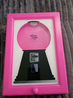 Wall mounted candy dispenser