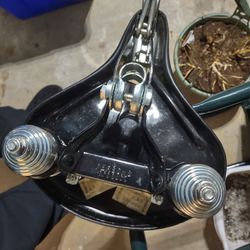 Persons Black Bicycle Seat