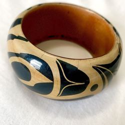 Authentic hand-carved wooden bangle “Eagle” by Haida artist Cory Bullpit. 
