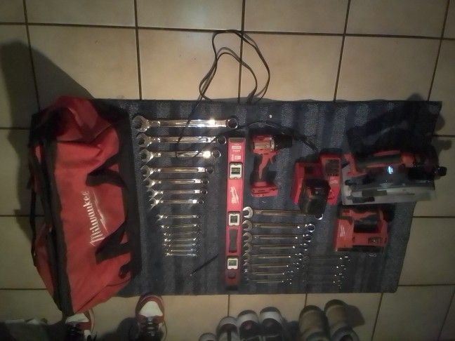 Milwaukee Steel Saw Drill Battery Charger Staple Gun Two Sets Of Wrenches Standard And Metric And The Level All Milwaukee With The Bag
