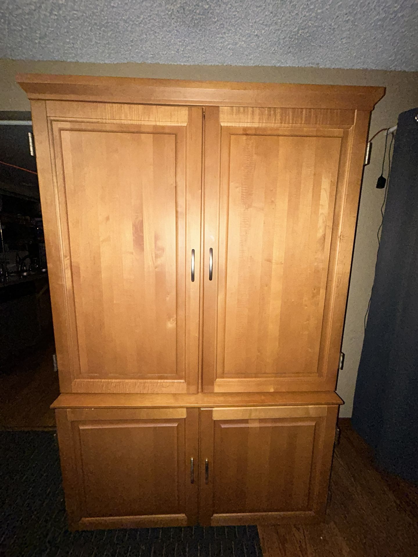 This piece of furniture can be used as a wardrobe or as a computer desk.74”H 46”W. 21”D comes in two pieces.