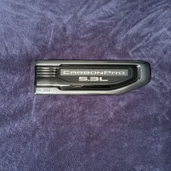 Black chrome with carbon box 5.3L Passenger Side Emblem