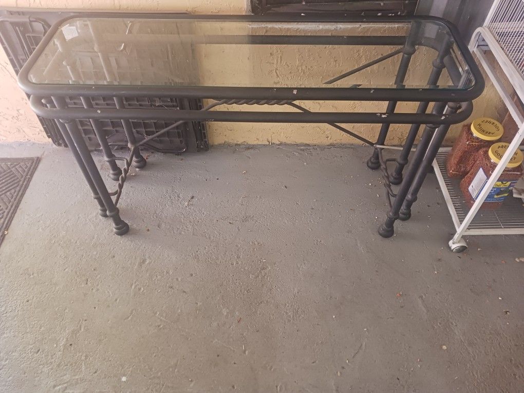 Metal table with glass top 65" x 16" x 26"