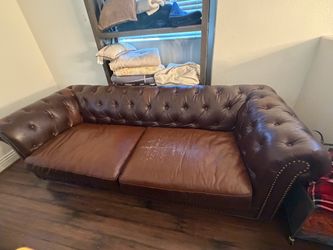 Faux leather tufted sofa