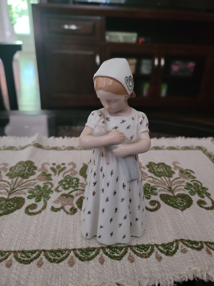 PBing and Grondahl Copenhagen - B&G - #1721 Mary Girl With Doll. Measures 7.5” tall.