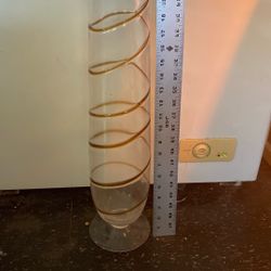 Tall Glass with Gold trimmings Around The Vase. 