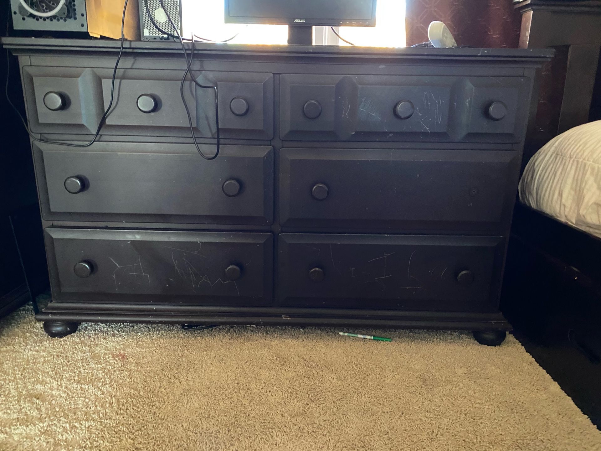 Full size bed frame, mattress, dresser with drawers, and armoire with drawers