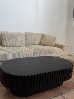 Black Oval Wood Slat Coffee Table