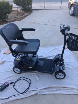 PRIDE MOBILITY 4 WHEEL ASSEMBLE SCOOTER BRAND NEW.