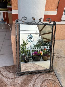 Very nice, high-quality mirror with a sturdy metal frame; measures 32 x 22 inches.