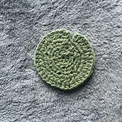 A frog coaster, lily pad