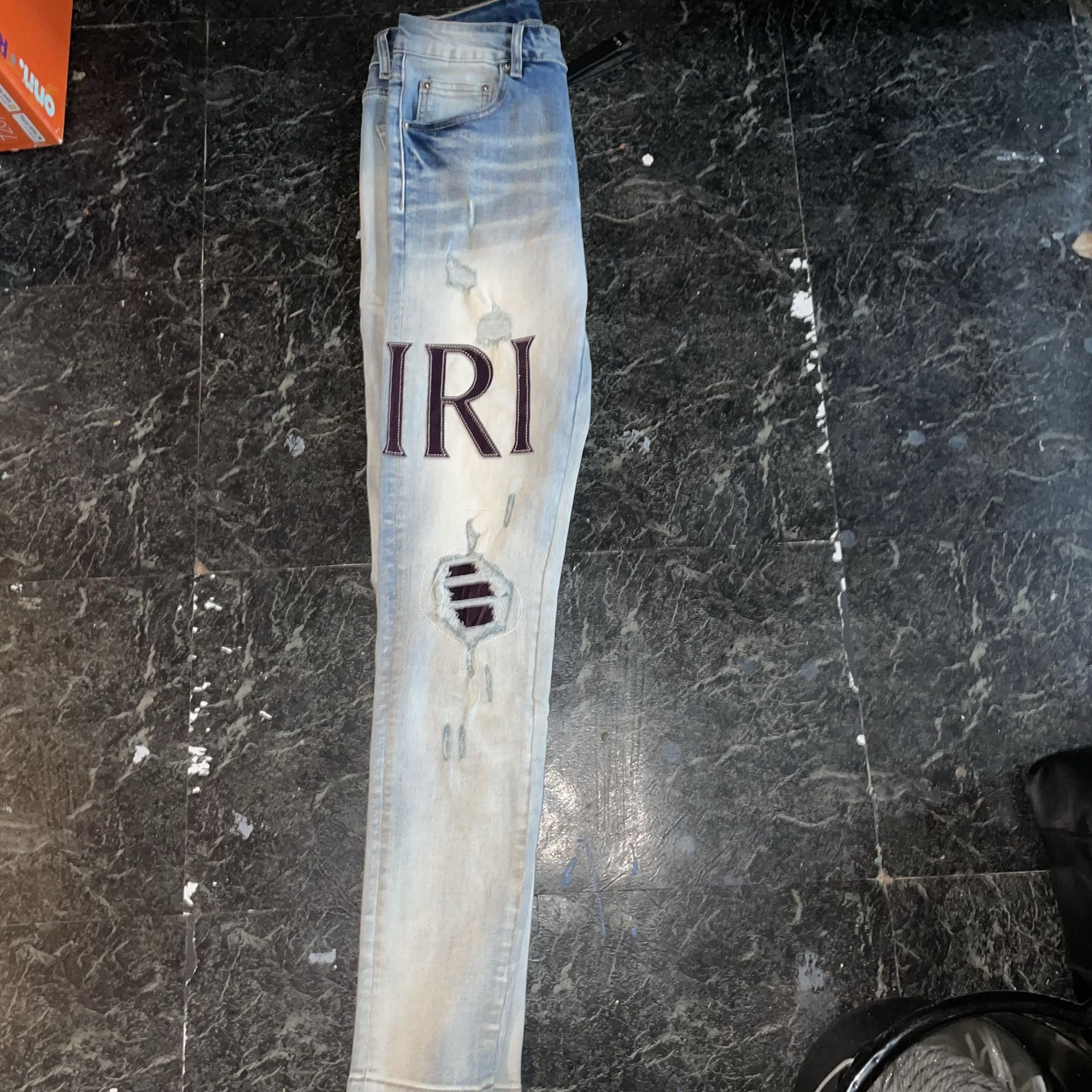 AMIRI Distressed Light Blue Skinny Jeans Slim Fit Denim with Logo Accents
