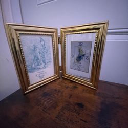 Bulova Peter Rabbit picture frame clock. It is a folding brass frame with a clock featuring the Peter Rabbit character. 