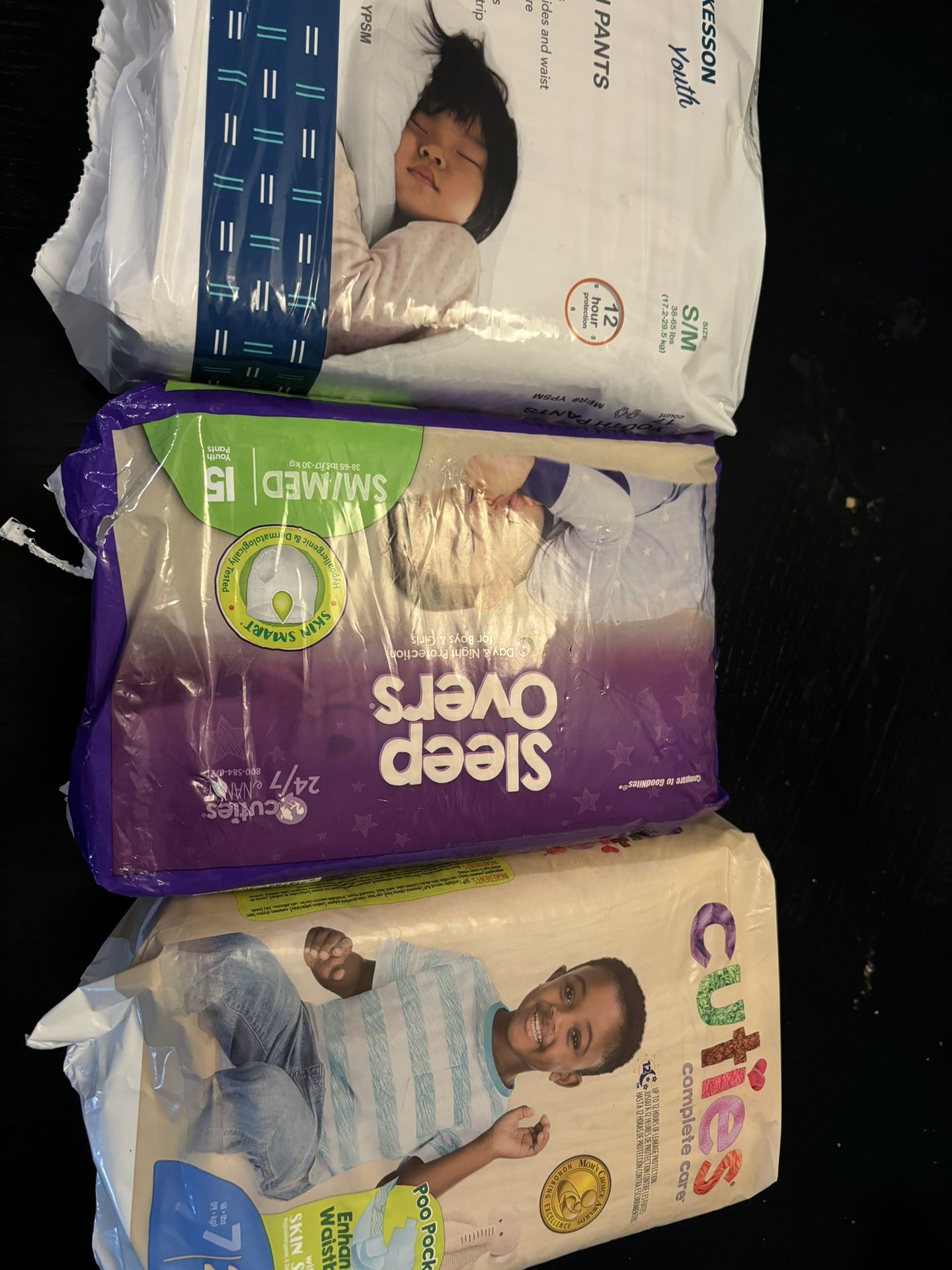 4 packs of diapers pull-ups or regular size 6-7