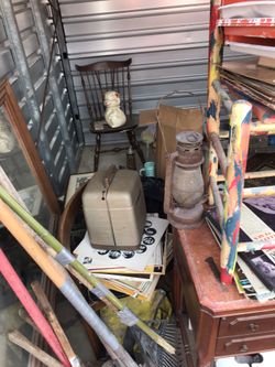 Antique lantern, sewing machine, belle and Howell projector, dresser missor