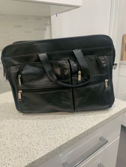 BLACK LEATHER BRIEFCASE 25.00