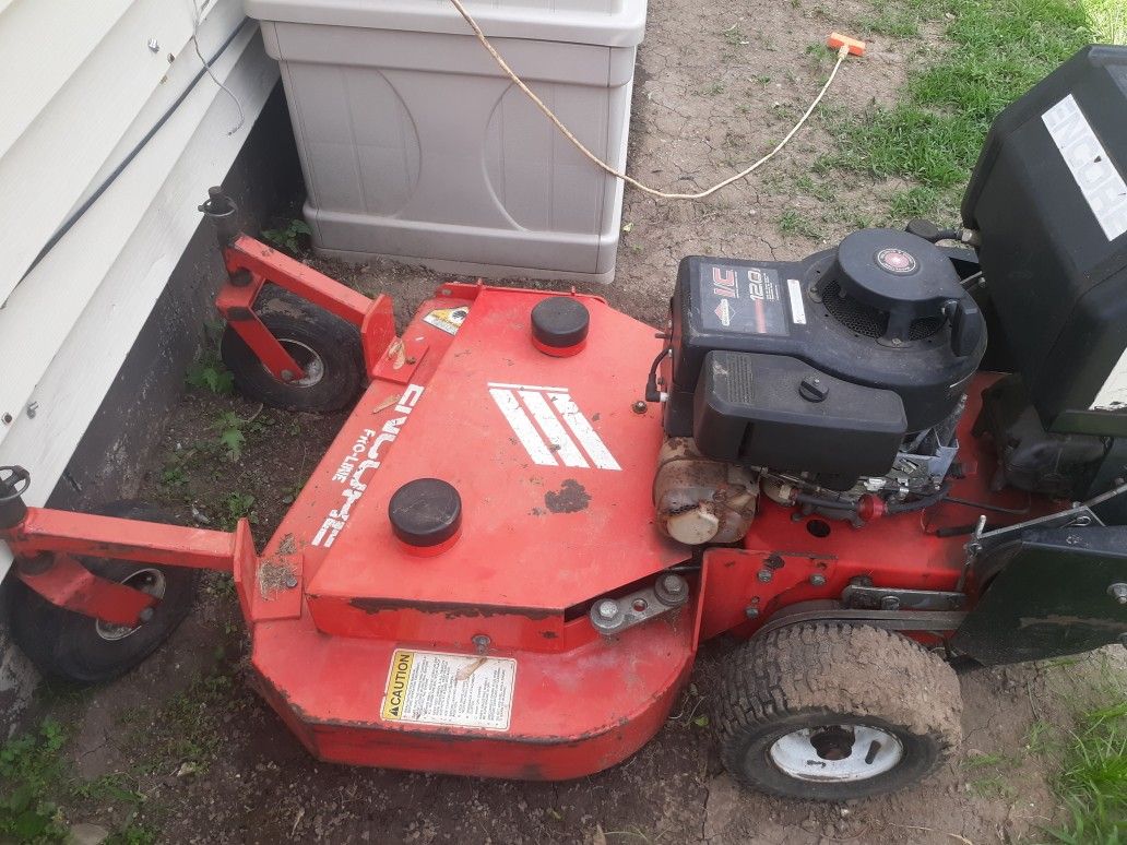 Stand behind lawn mower