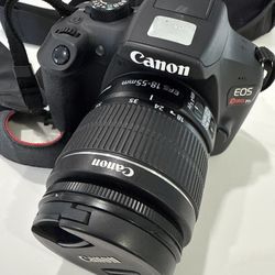 Canon EOS Rebel T6 DSLR camera with an EF-S 18–55mm zoom lens attached